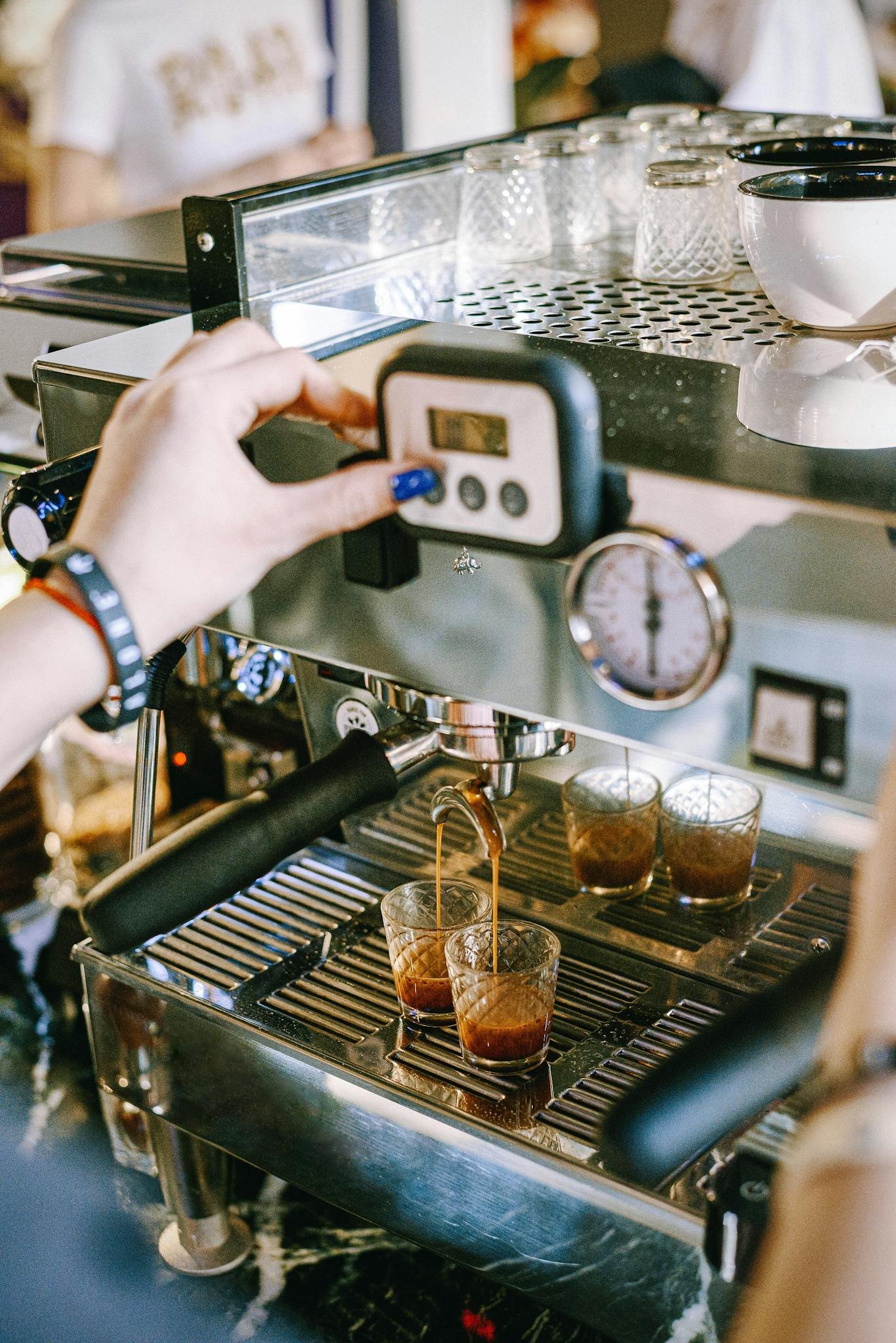 Person Holding Black and Silver Coffee Maker